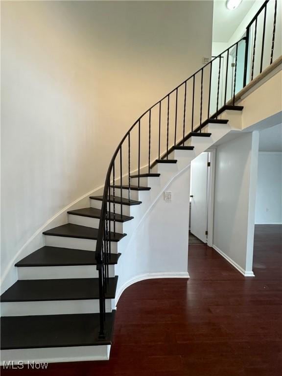 stairs with wood-type flooring