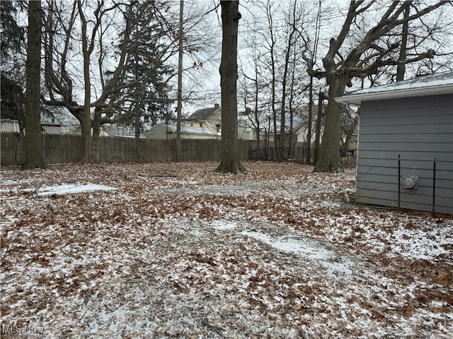 view of yard layered in snow