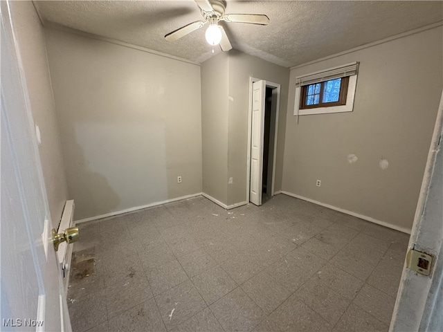 unfurnished bedroom with a textured ceiling and ceiling fan