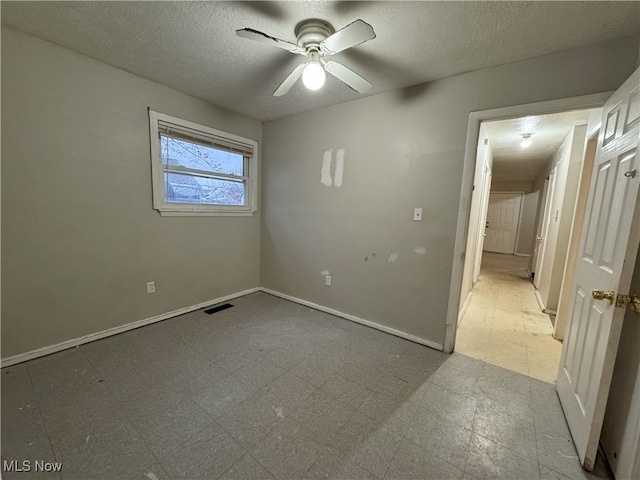 spare room with ceiling fan