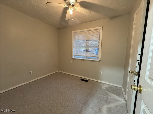 unfurnished room featuring a textured ceiling and ceiling fan