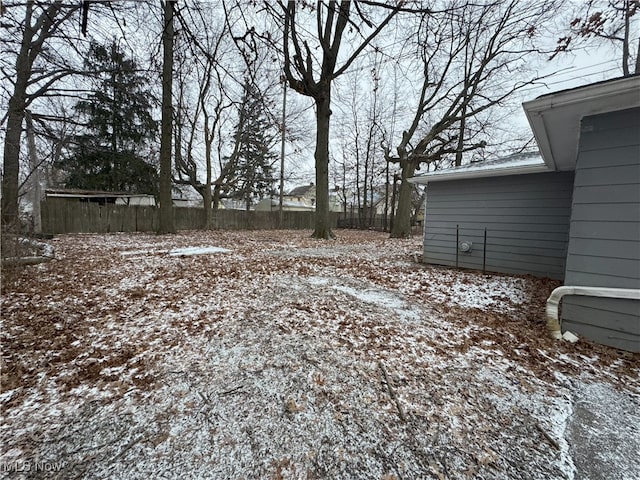 view of yard covered in snow