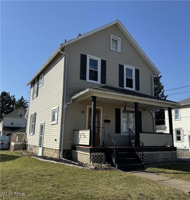 view of front of home with a front lawn and covered porch