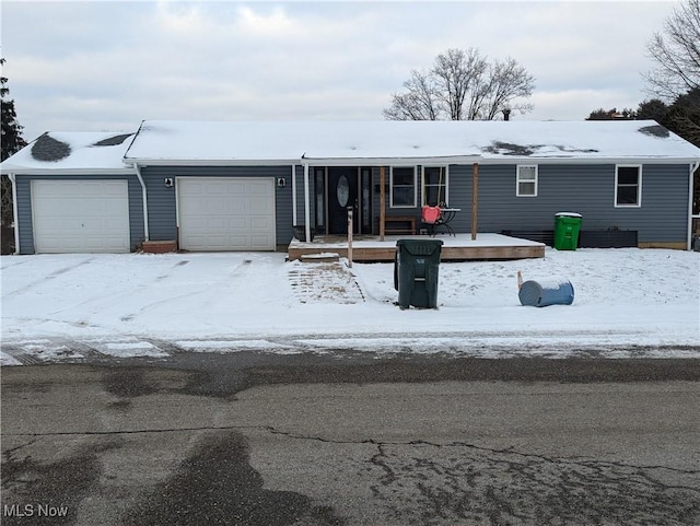 view of front of house with a garage and a deck