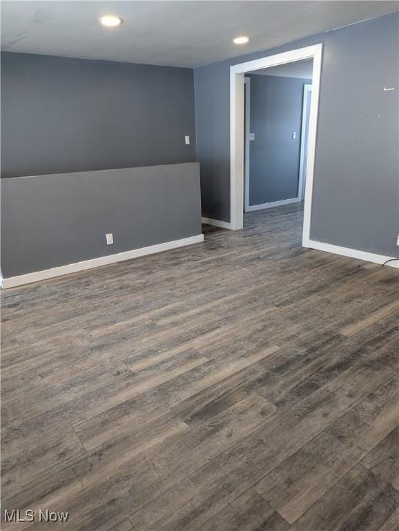 empty room with dark hardwood / wood-style floors