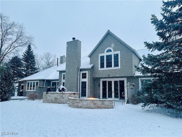 view of snow covered house