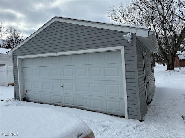 view of snow covered garage