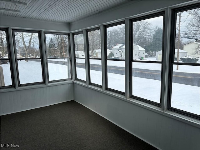 unfurnished sunroom with a wealth of natural light