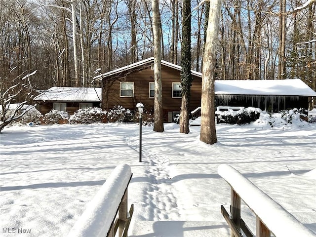 view of yard layered in snow