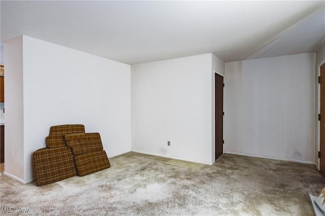 unfurnished room with light carpet