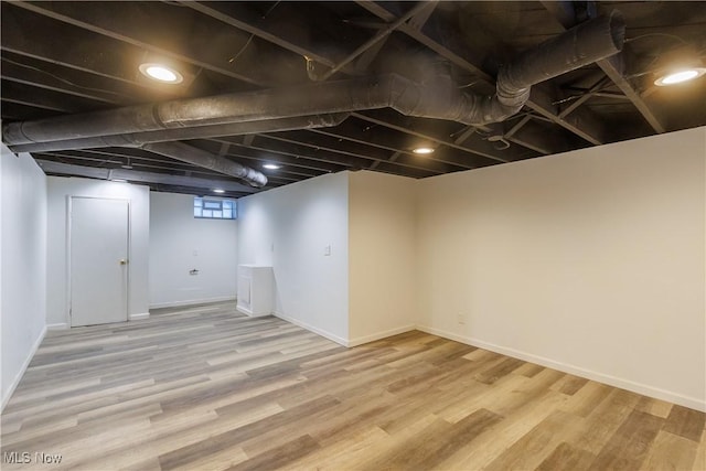 basement featuring wood-type flooring