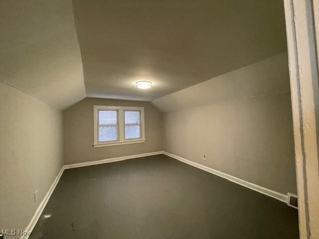 bonus room featuring lofted ceiling