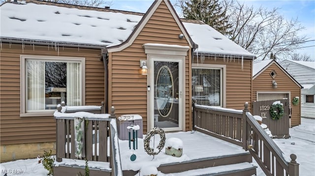 view of snow covered property entrance