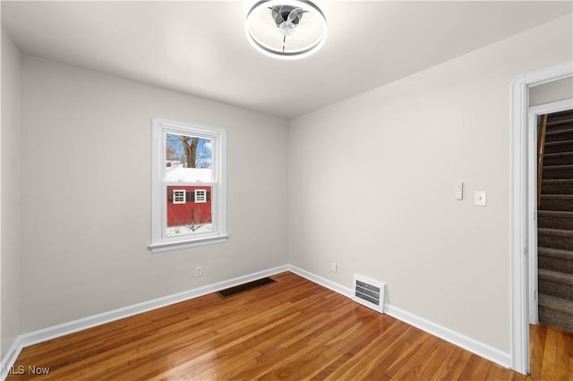 spare room with light hardwood / wood-style flooring