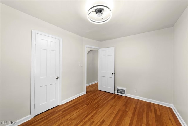 unfurnished bedroom featuring hardwood / wood-style floors