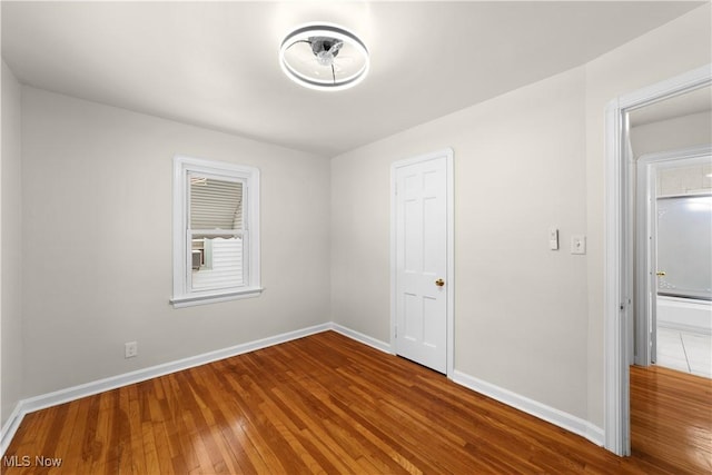 unfurnished bedroom featuring hardwood / wood-style floors