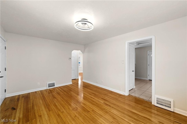 spare room featuring light hardwood / wood-style flooring