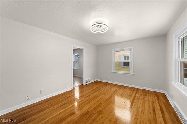 spare room featuring hardwood / wood-style flooring