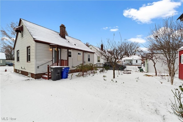 view of snow covered house