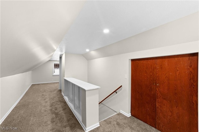 bonus room with carpet and vaulted ceiling