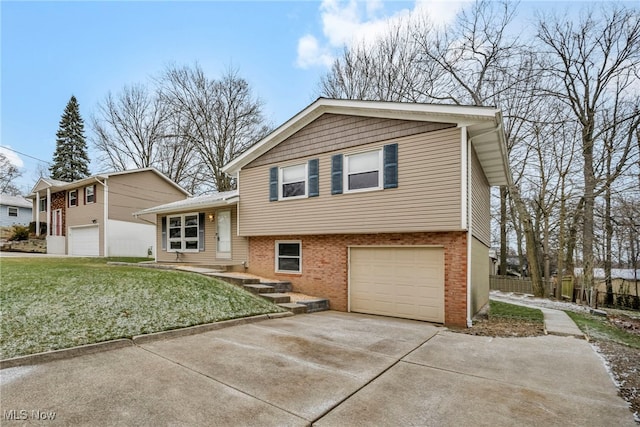 split level home with a garage and a front lawn