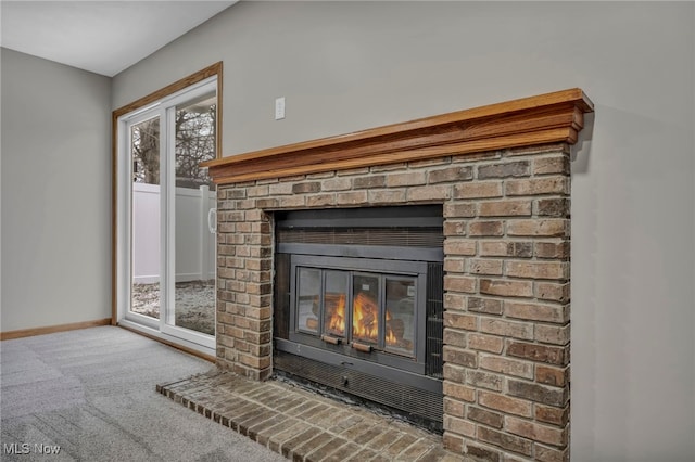 room details with carpet flooring and a fireplace