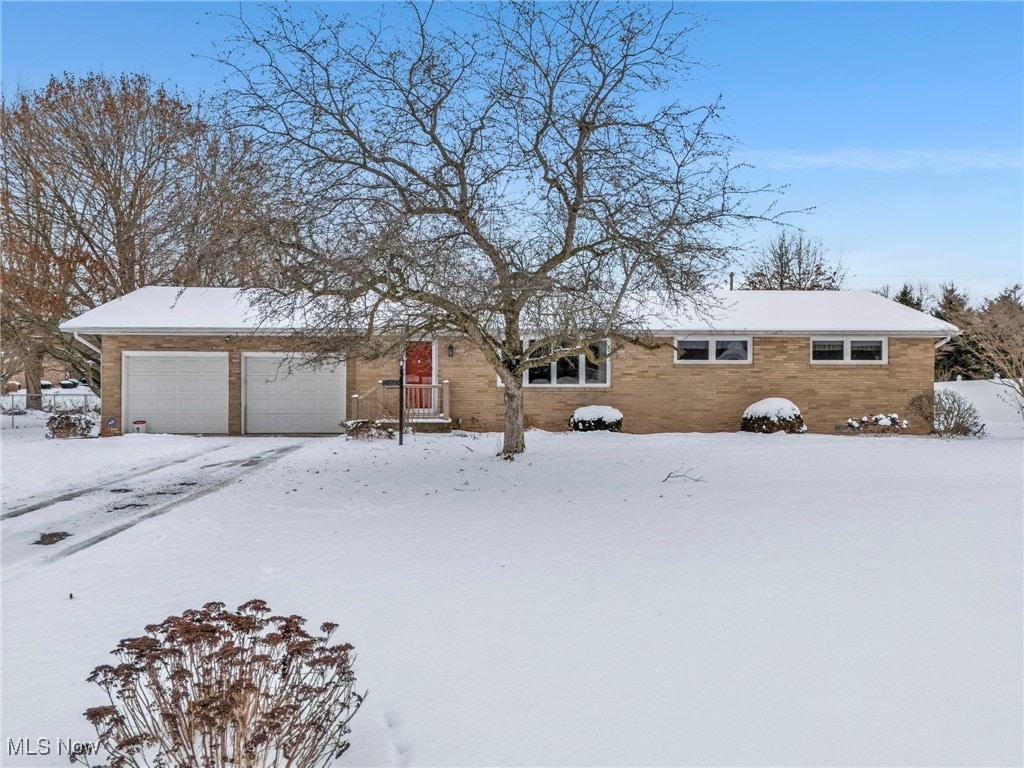 ranch-style home with a garage