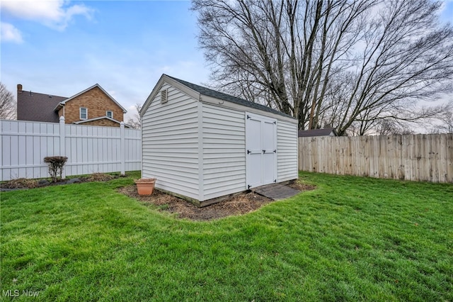 view of outdoor structure featuring a lawn