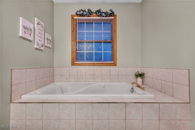 bathroom featuring tiled bath