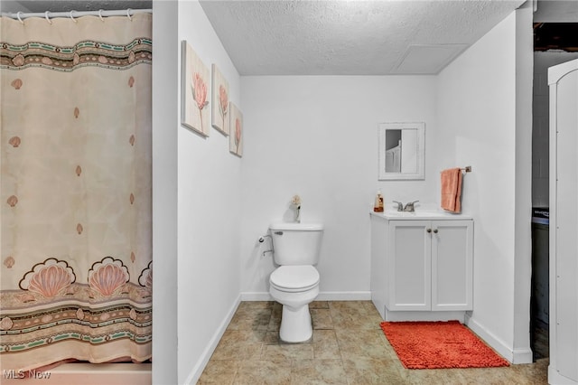 bathroom with a textured ceiling, vanity, toilet, and a shower with curtain