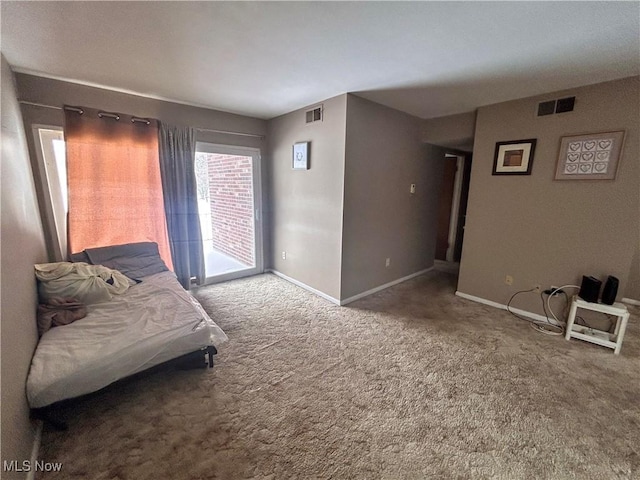 carpeted bedroom featuring access to exterior