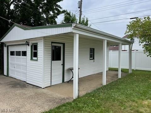 garage featuring a yard