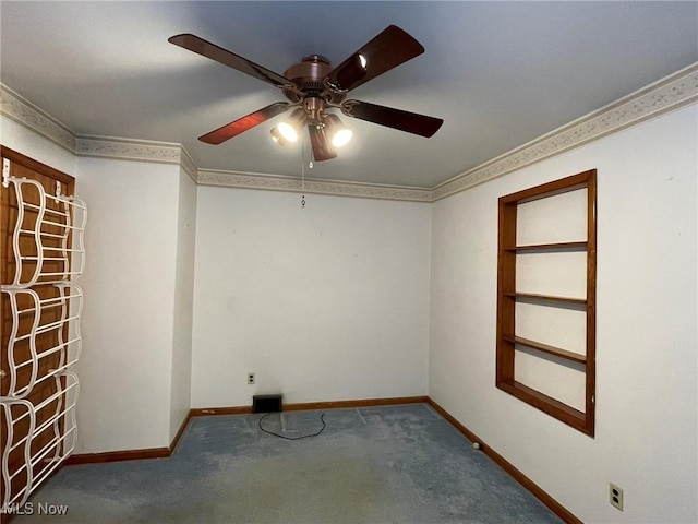 spare room with ceiling fan and carpet flooring