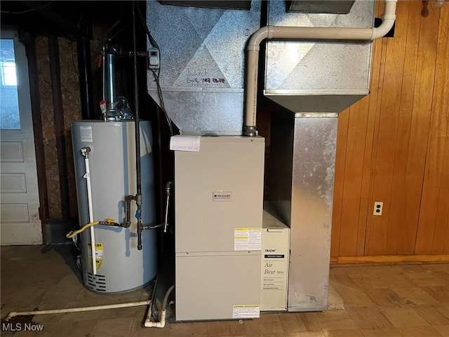 utility room with gas water heater