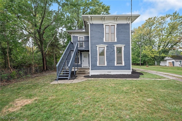 italianate-style house with a front yard