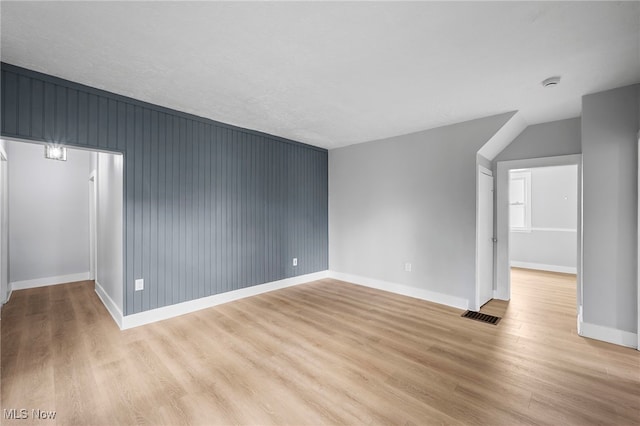 spare room featuring light hardwood / wood-style floors