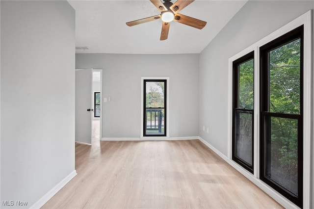 spare room featuring ceiling fan and light wood-type flooring