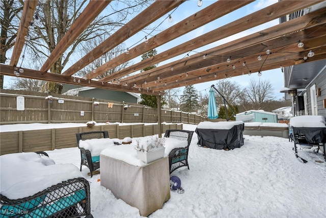 yard layered in snow featuring a pergola