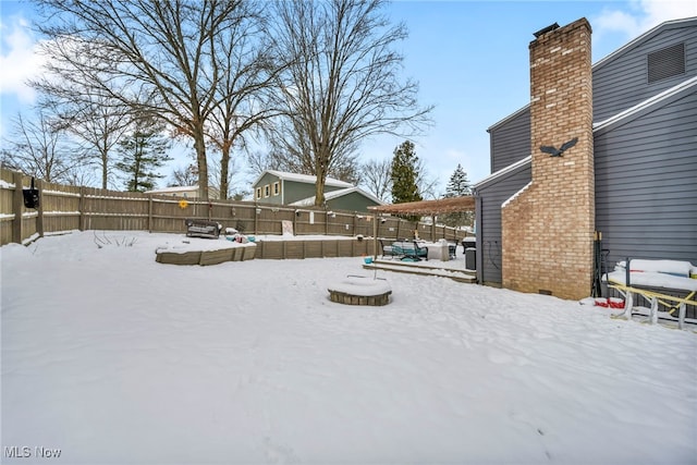 view of yard covered in snow