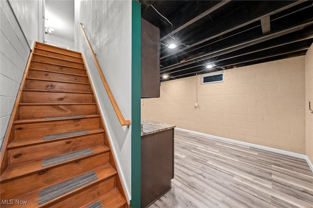 stairway featuring hardwood / wood-style floors