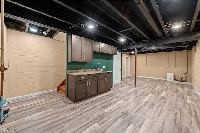 interior space featuring sink and light wood-type flooring