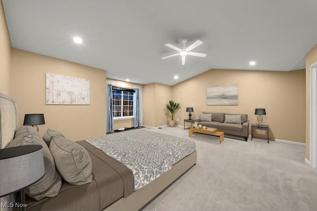 bedroom with ceiling fan, light carpet, and vaulted ceiling