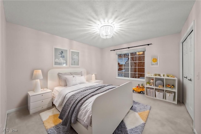 carpeted bedroom with a closet