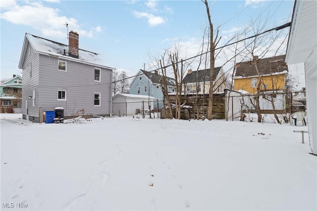 view of snow covered house