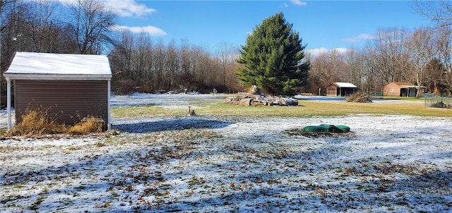 view of yard layered in snow