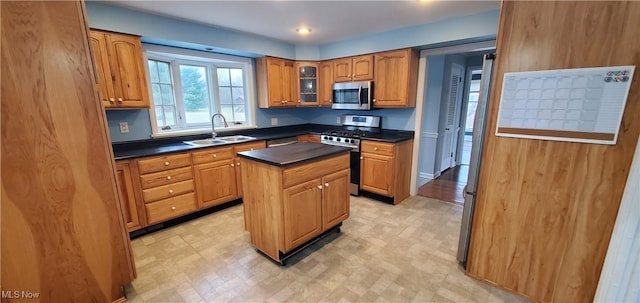 kitchen with a center island, sink, and appliances with stainless steel finishes