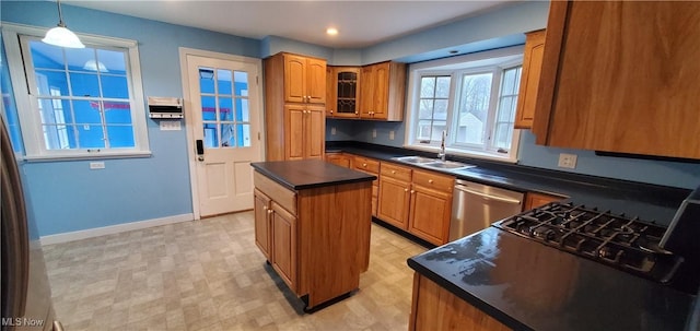 kitchen with dishwasher, a center island, hanging light fixtures, and sink