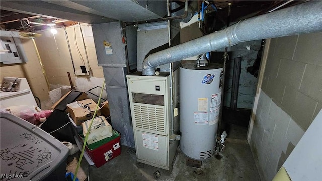 utility room featuring electric panel and water heater