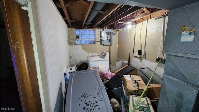 basement featuring washer / clothes dryer and electric panel