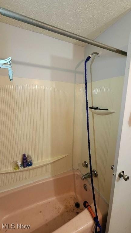 bathroom with shower / washtub combination